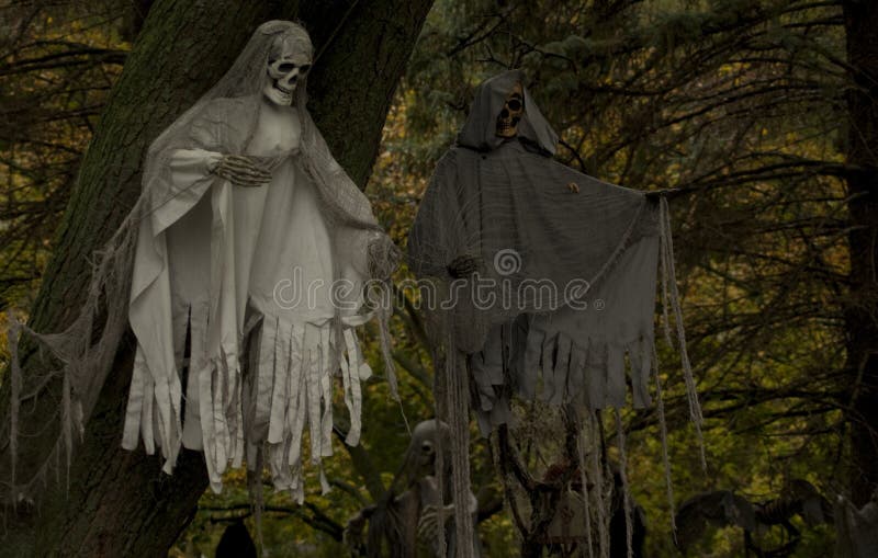 Creepy Halloween Ghosts in the Trees