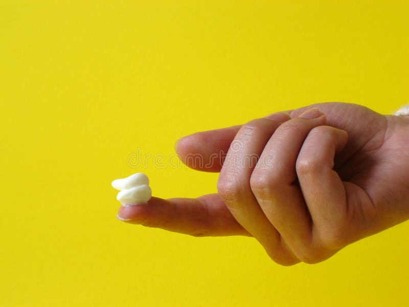 Creme on a finger stock image. Image of white, soft, hand 542467