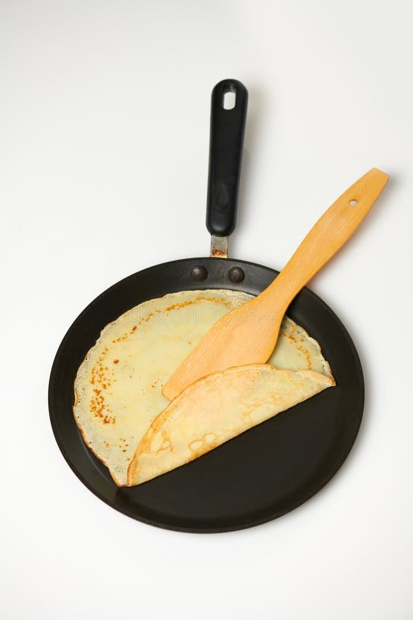 Crepe Closeup, Thin Pancake on a Frying Pan, White Background Stock
