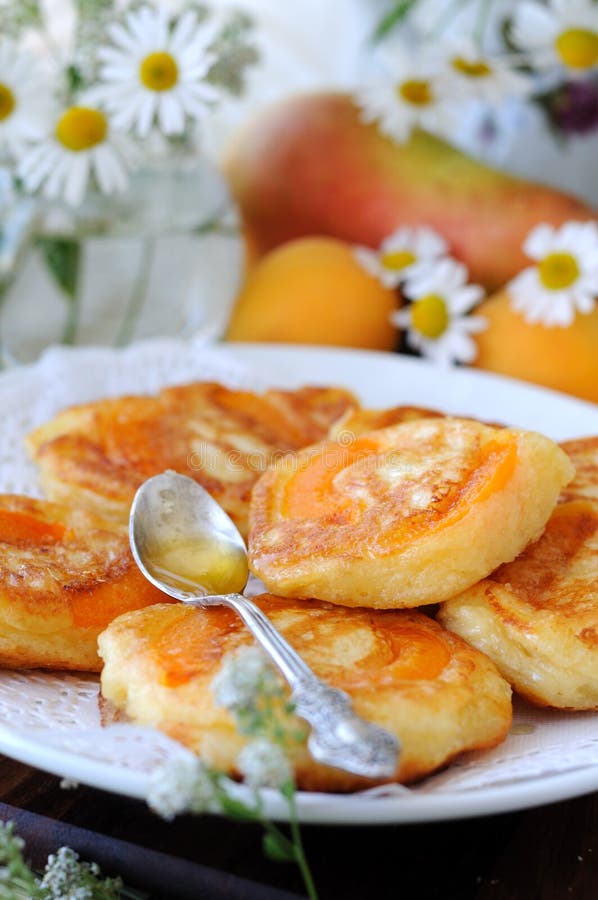 Thick pancakes with apricot inside. Thick pancakes with apricot inside.