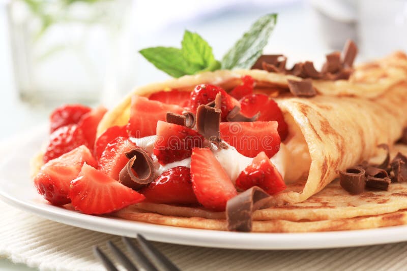 Crepes with curd cheese and strawberries