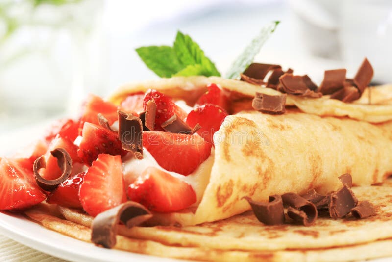 Crepes with curd cheese and strawberries