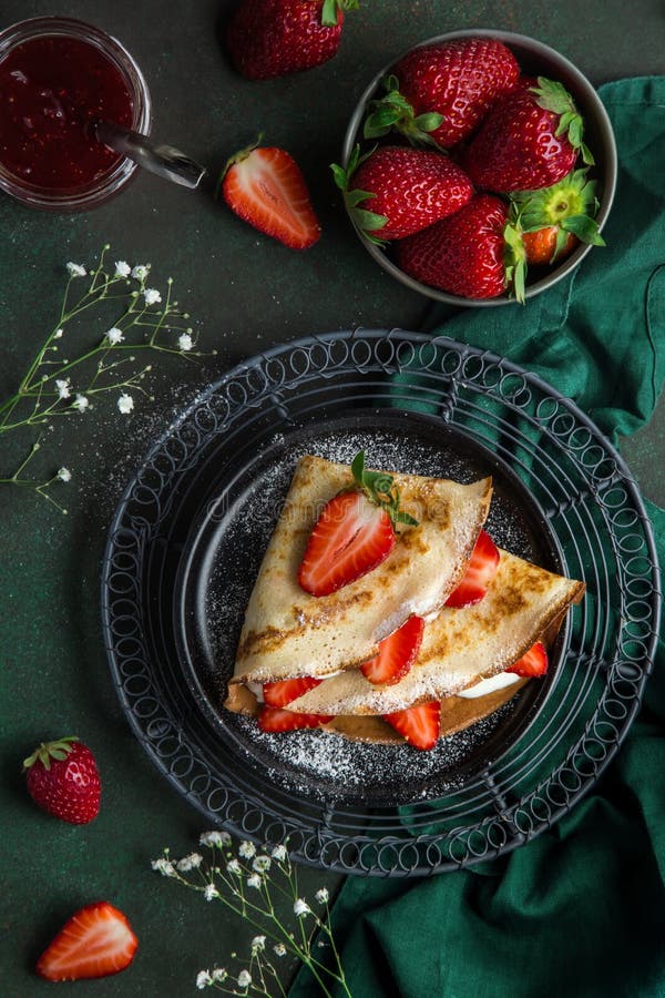 Crepes served with cream cheese and fresh strawberry