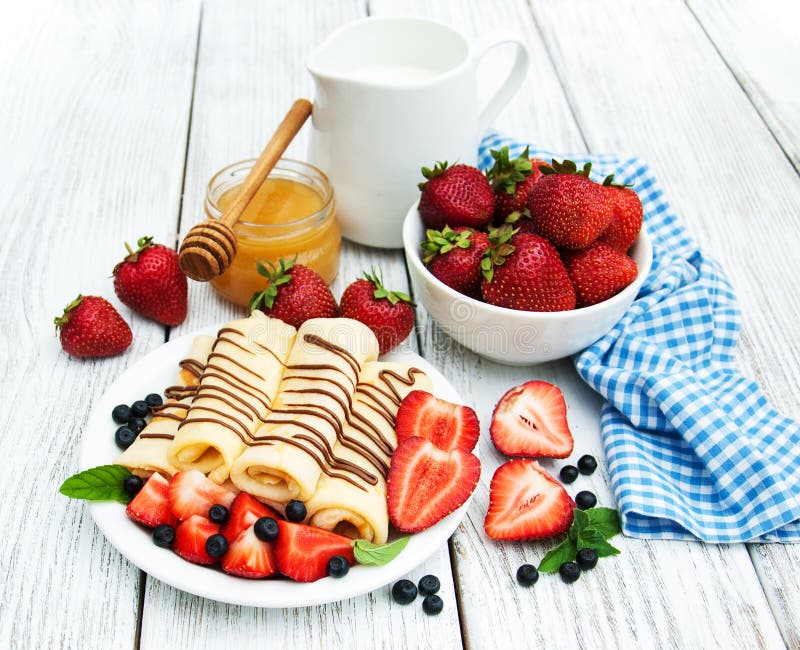 Crepes with strawberries and chocolate sauce