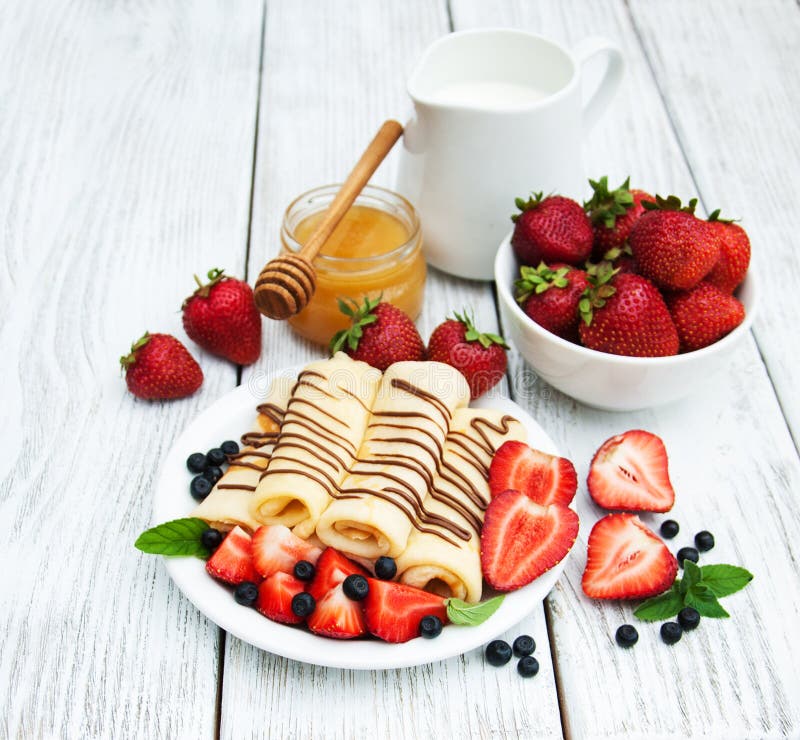 Crepes with strawberries and chocolate sauce