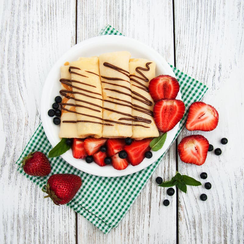 Crepes with strawberries and chocolate sauce