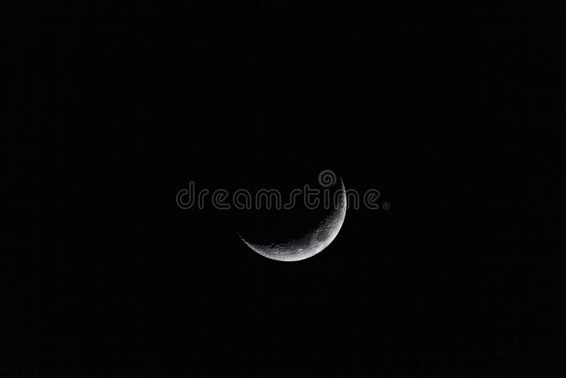 Crescent moon on a dark sky stock image Crescent moon on a dark sky stock image