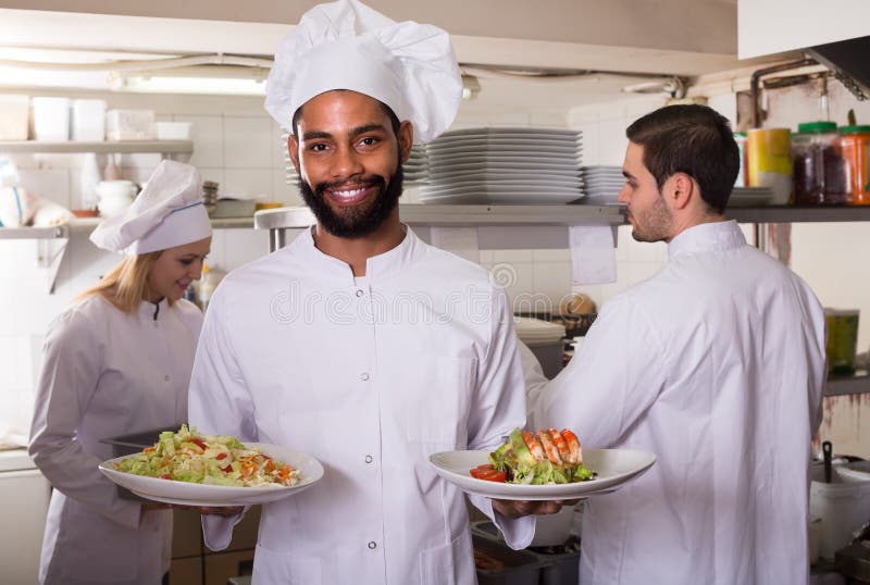 Crew of Professional Cooks Working at Restaurant Stock Image Image of