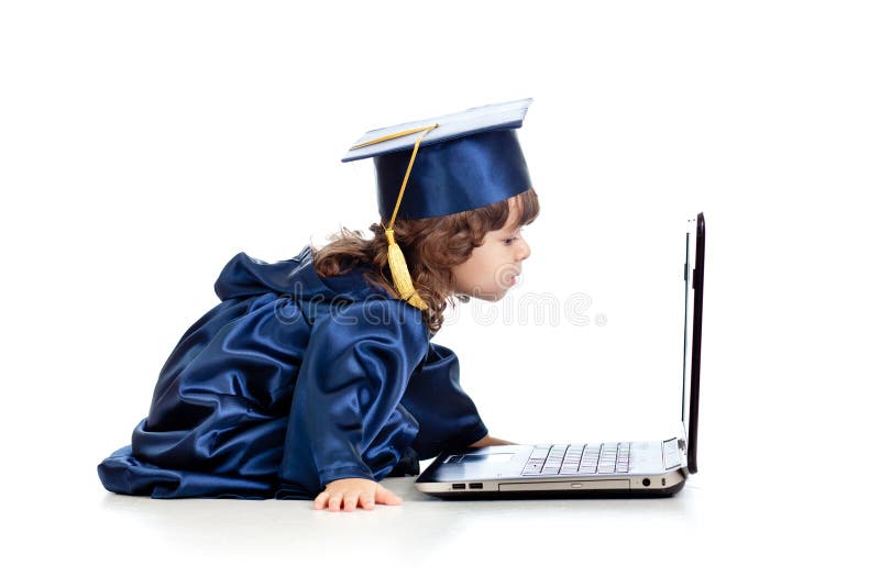 Criança engraçada como o portátil de utilização académico foto de stock Criança engraçada como o portátil de utilização académico foto de stock