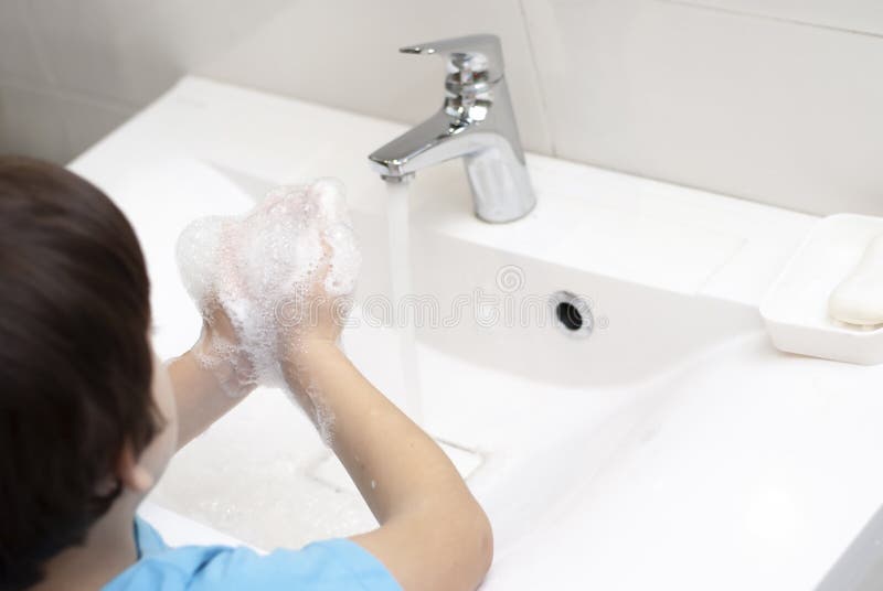 Kid wash hands with much soap carefully. hygiene and flu covid pandemic prevention. Helth care for children lifestyle closeup picture. Water and soap. Kid wash hands with much soap carefully. hygiene and flu covid pandemic prevention. Helth care for children lifestyle closeup picture. Water and soap