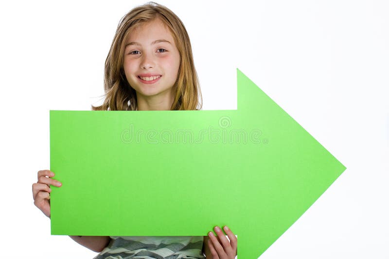 A cute young girl holding a green arrow, blank sign pointing to the right. A cute young girl holding a green arrow, blank sign pointing to the right.