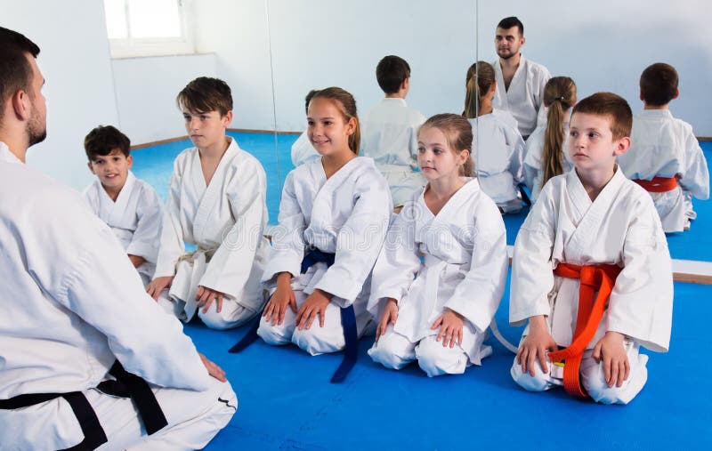 Different ages kids expressing interest in attending karate class. Different ages kids expressing interest in attending karate class