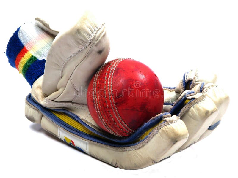 Cricket glove holding red ball