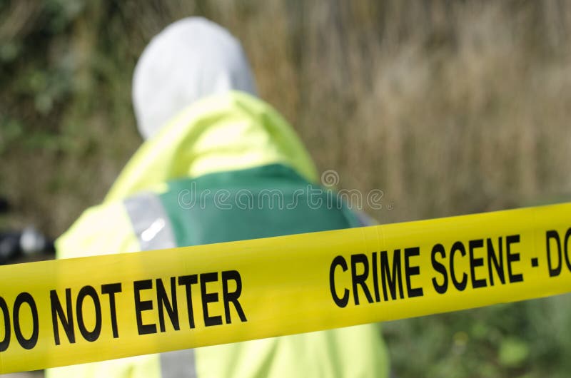 Forensic detective working at a crime scene