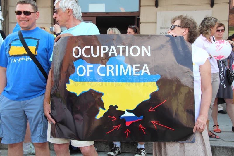 WARSAW, POLAND - July 27: The pro-Ukrainian protest against policy of the president of Russia Vladimir Putin, on July 27, 2014 in Warsaw, Poland. WARSAW, POLAND - July 27: The pro-Ukrainian protest against policy of the president of Russia Vladimir Putin, on July 27, 2014 in Warsaw, Poland.