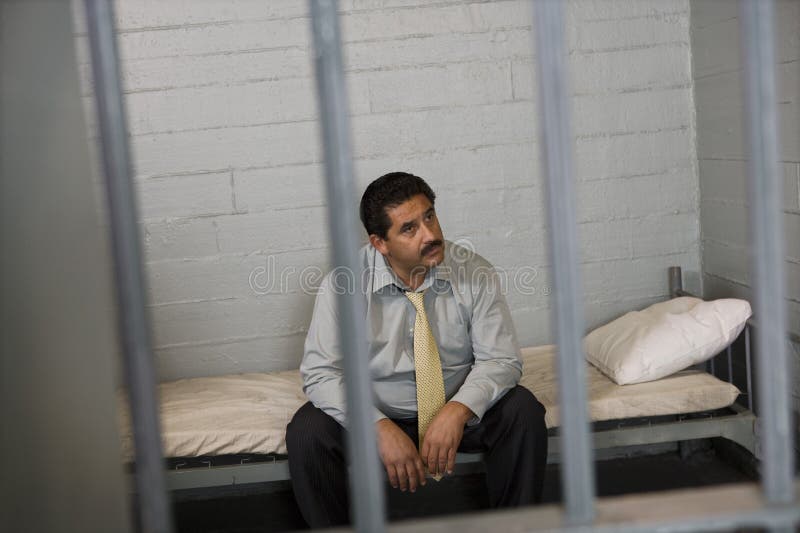 Man Sitting on Bed in Prison Cell Stock Photo Image of adult, anxiety