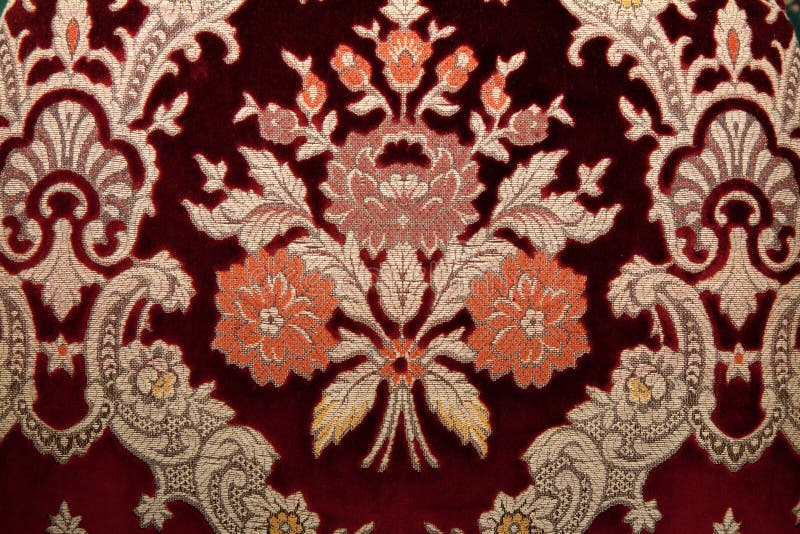 Crimson fabrics with golden pattern