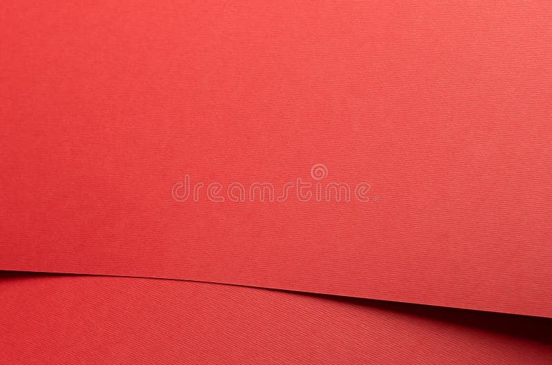 Crimson red paper background with a matte texture and soft tones. Rich ruby and maroon hues create a stock image