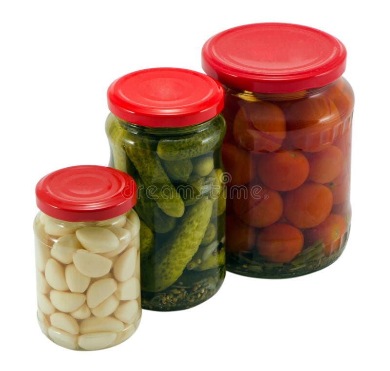 Crisol de cristal conservado tomates del tarro del pepino del ajo fotografía de archivo libre de regalías Crisol de cristal conservado tomates del tarro del pepino del ajo fotografía de archivo libre de regalías