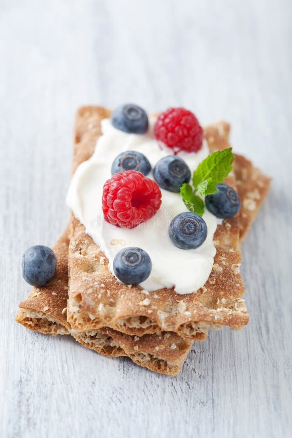 Crisp bread with creme fraiche and berries royalty free stock photo Crisp bread with creme fraiche and berries royalty free stock photo