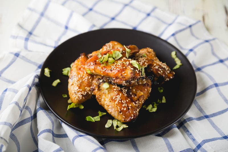 Crispy Chicken Wings with Sesame Seeds and Chopped Herbs Stock Image Image of crispy, sauce