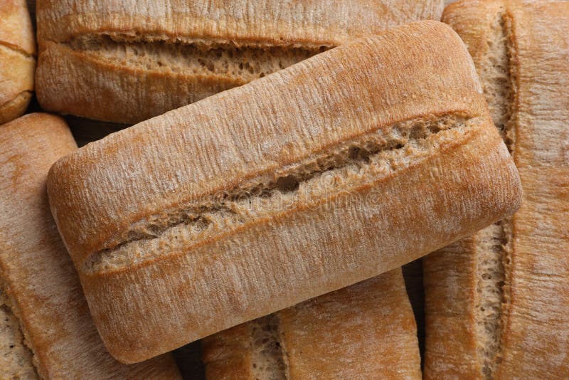 Crispy ciabattas as background, top view. Fresh bread