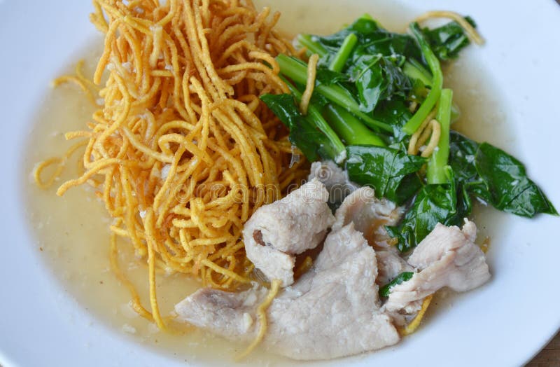Crispy Egg Noodle with Chinese Kale and Pork in Gravy Sauce Stock Image