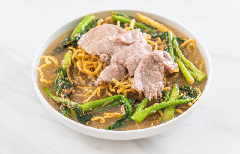 Crispy Egg Noodles with Chinese Broccoli and Pork Stock Photo Image