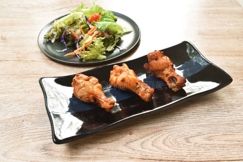 Crispy Fried Chicken Drum Wing with Barbecue Sauce and Vegetable on