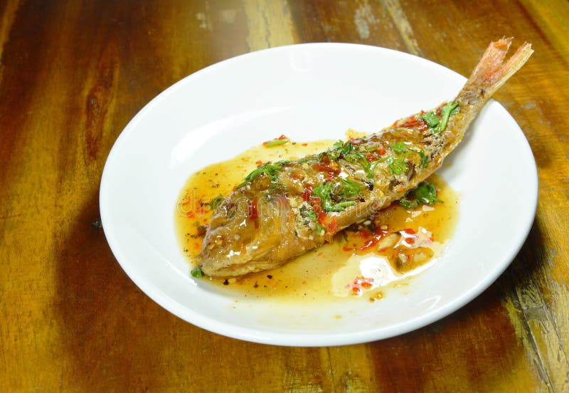 Crispy Fried Sharp Tooth Snapper Dressing with Sweet Chili Sauce on