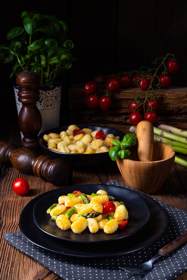 Crispy Gnocchi with Roasted Asparagus and Tomatoes Stock Image Image