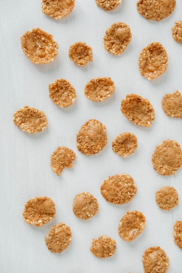 Crispy Healthy Dry Cereal Flakes on White Background Stock Photo