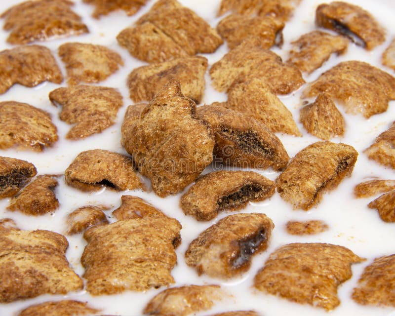 Chocolate Pillows for Breakfast Isolated on White Background. Brown Choco Cereal Pads with Cream