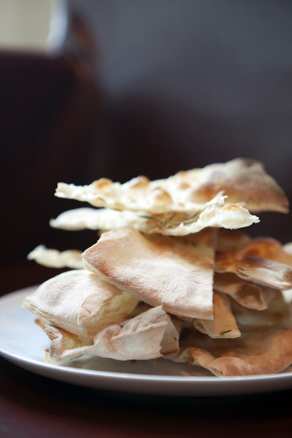 Crispy pizza bread on white plate stock photos