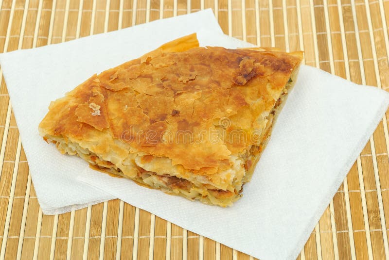 Crispy Pizza burek or pie on a paper serviettes