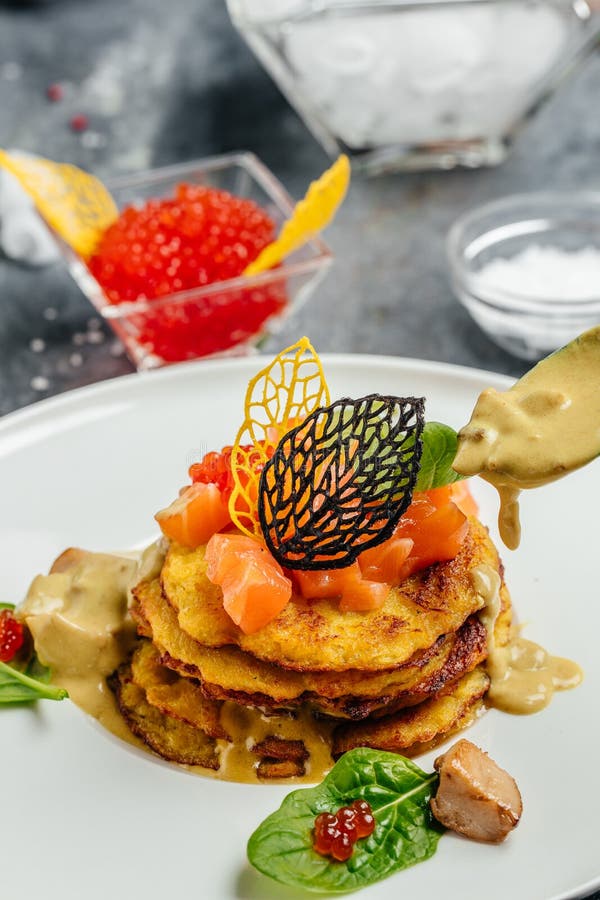 Crispy Potato Pancakes with Red Caviar, Red Fish and Mushroom Sauce