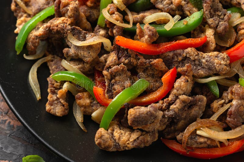 Crispy Salt and Pepper Beef with Onion and Bell Peppers Stock Image