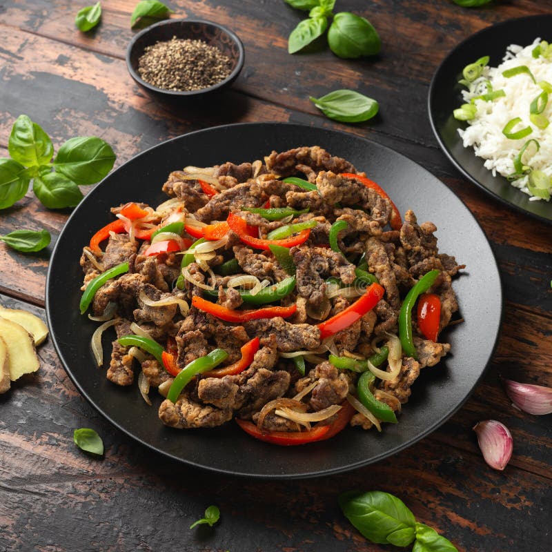 Crispy Salt and Pepper Beef with Onion and Bell Peppers Stock Photo