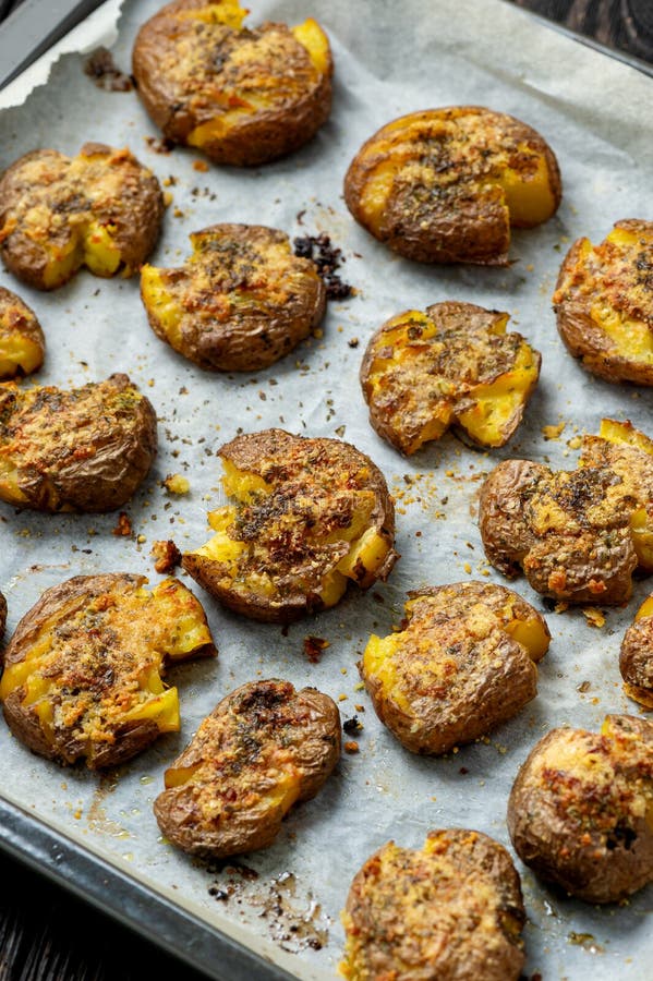 Crispy smashed potatoes roasted with garlic and parmesan. royalty free stock image