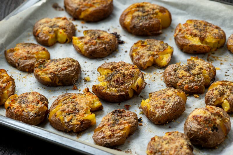 Crispy smashed potatoes roasted with garlic and parmesan. stock photos
