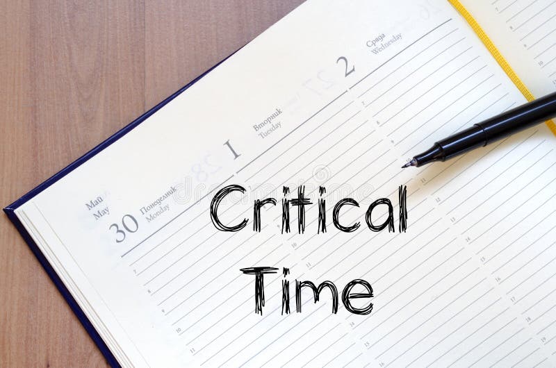 Critical time write on notebook stock photos