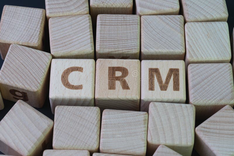 CRM, Customer Relationship Management, loyalty program, repeat purchase frequency concept, cube wooden block with alphabet combine royalty free stock image CRM, Customer Relationship Management, loyalty program, repeat purchase frequency concept, cube wooden block with alphabet combine royalty free stock image