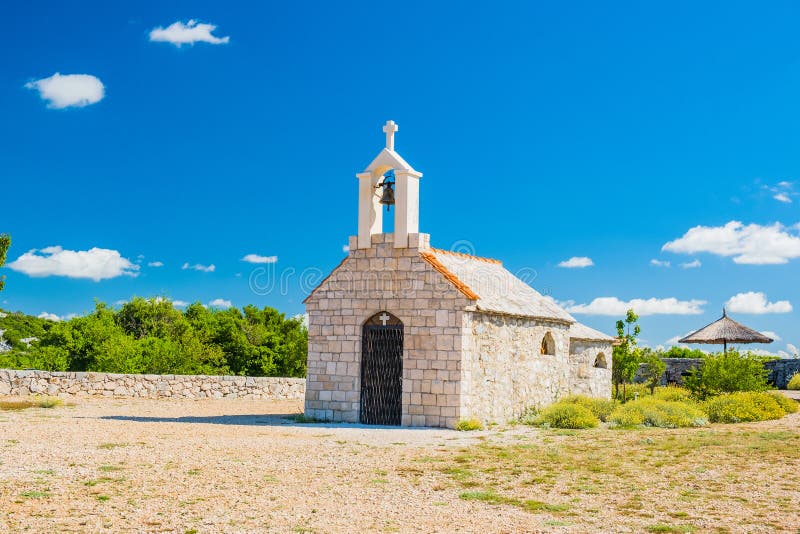 Croatia, mount Kamenjak on Vransko lake, beautiful old stone church on the hill