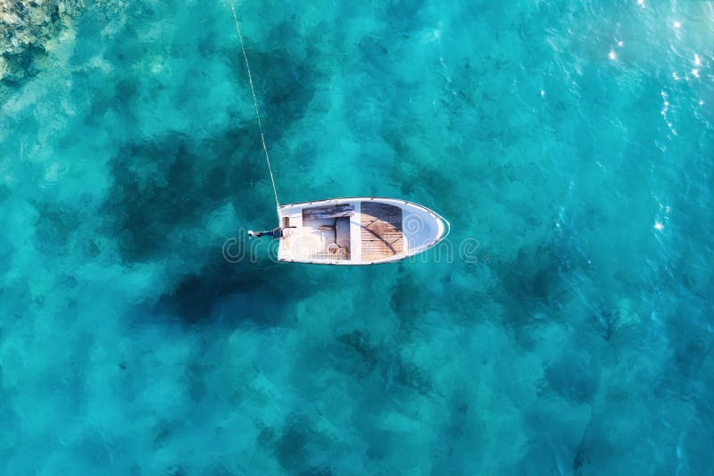 Croatia. Summer. Aerial view of floating boat on blue Adriatic sea at sunny day.  Boat on sea surface. Seascape from drone.