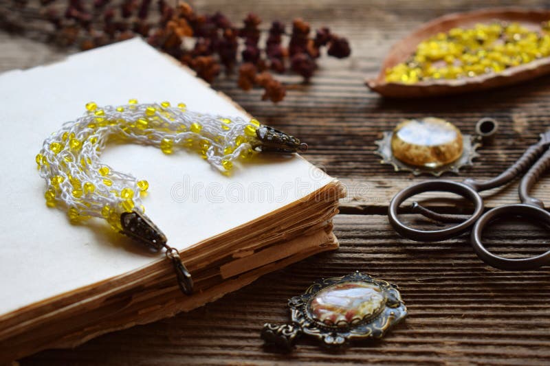 Crochet bracelet making with yellow beads and yarn on a wooden table â€“ DIY handmade jewelry project, needlework tutorial royalty free stock photos