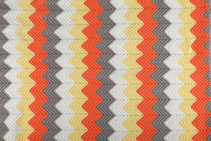 Crocheted warm bright blanket with royalty free stock photos