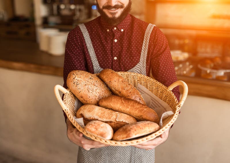 Baker with Basket Full of Bread in a Bakery Stock Image Image of