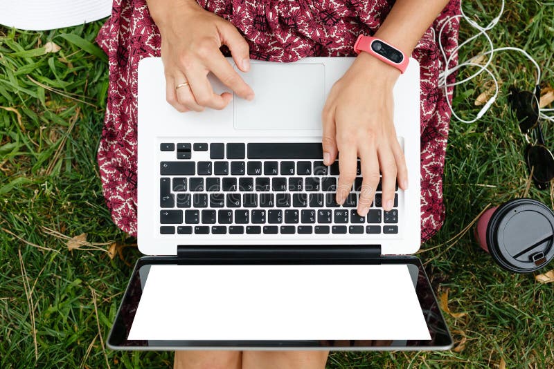 Crop top view of woman using laptop royalty free stock photography