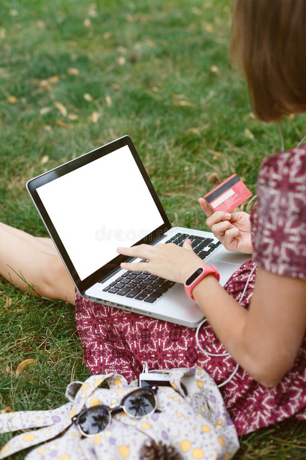 Anonymous woman shopping in Internet stock image