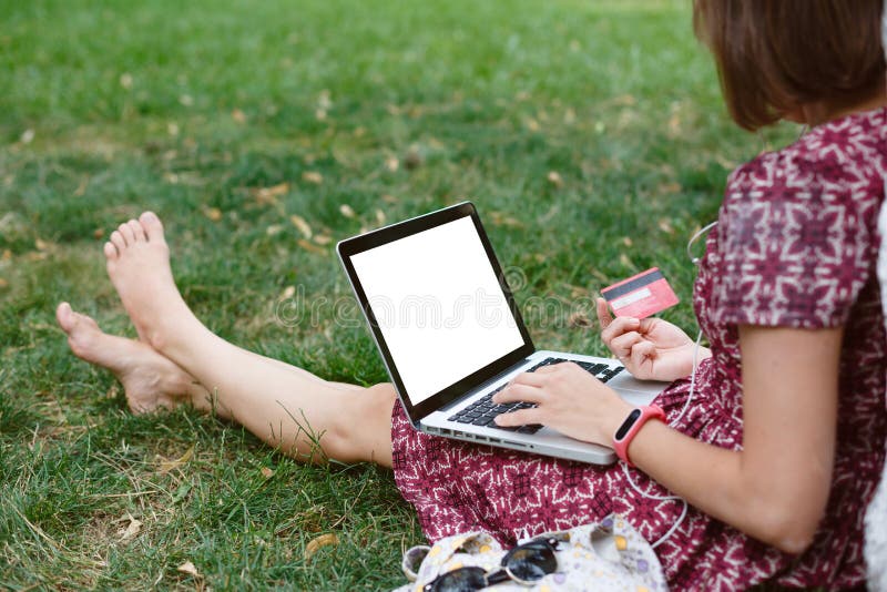 Anonymous woman shopping in Internet stock image